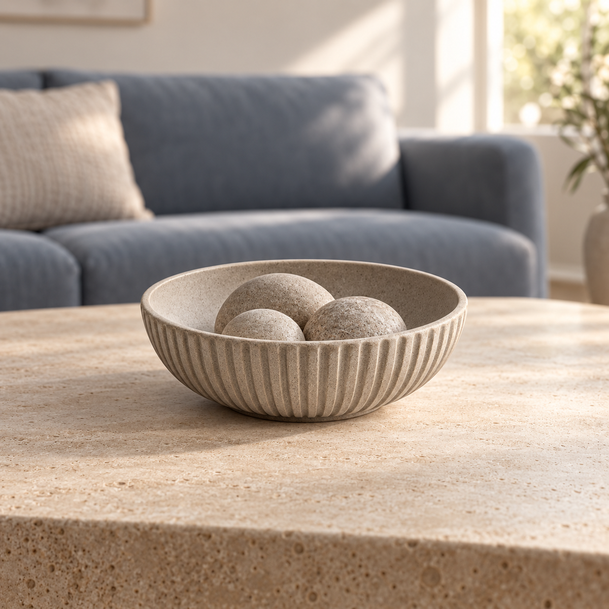 Nerisse Fluted Bowl centered on a stone coffee table