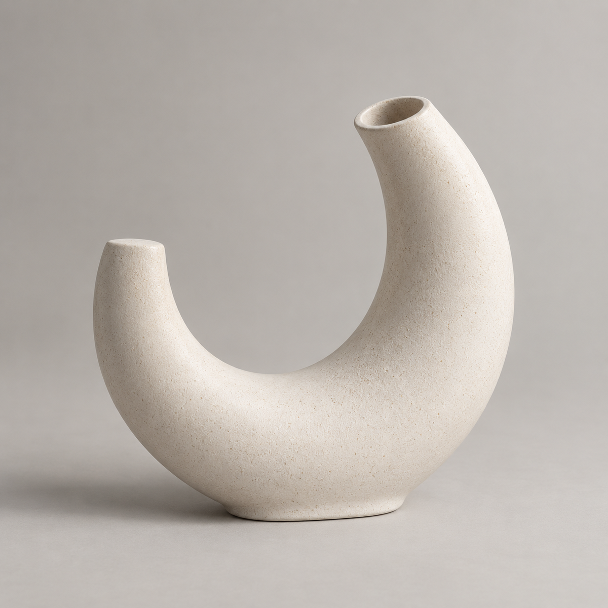 Solenne Arc Vase in a complete three-quarter studio view