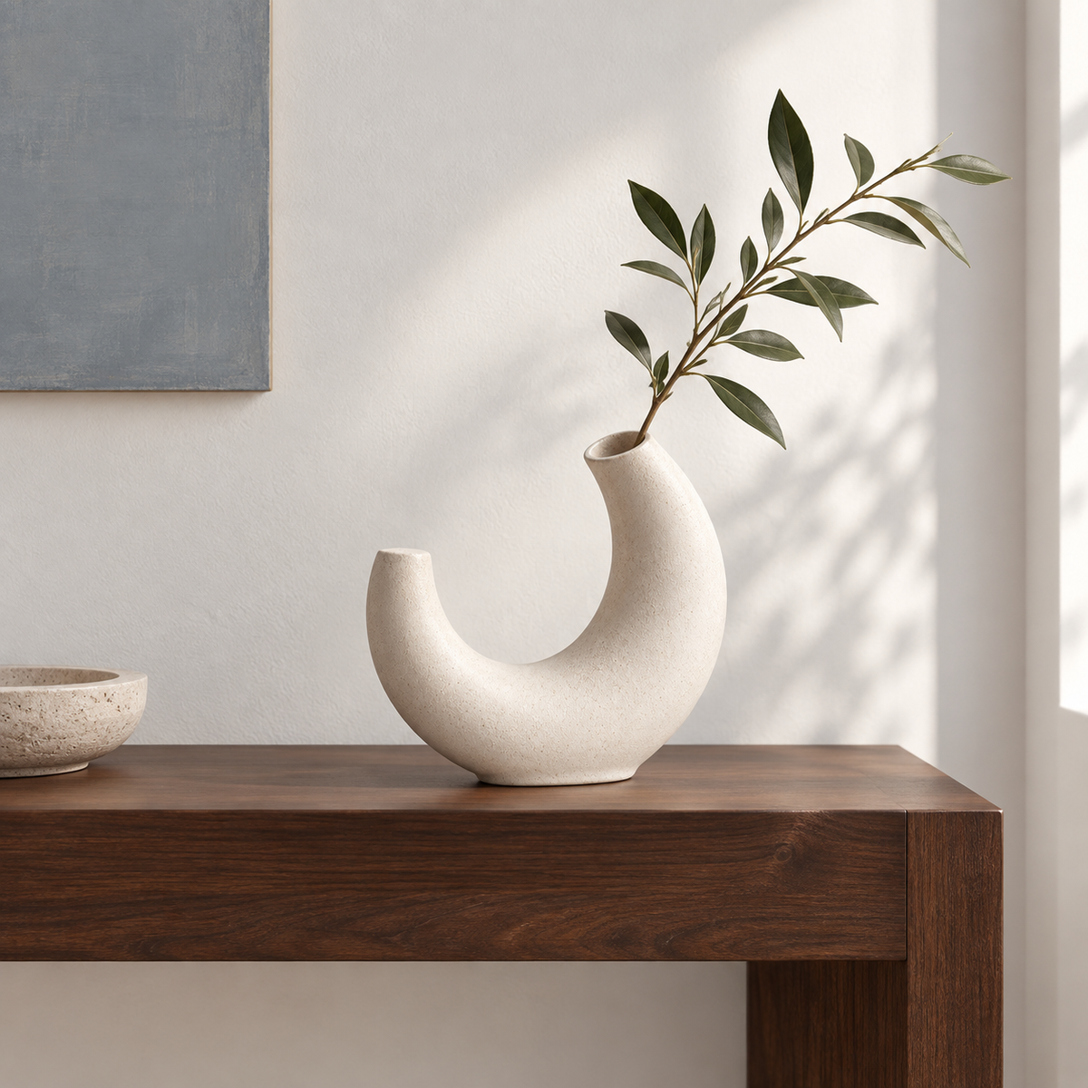 Solenne Arc Vase on a walnut entry console